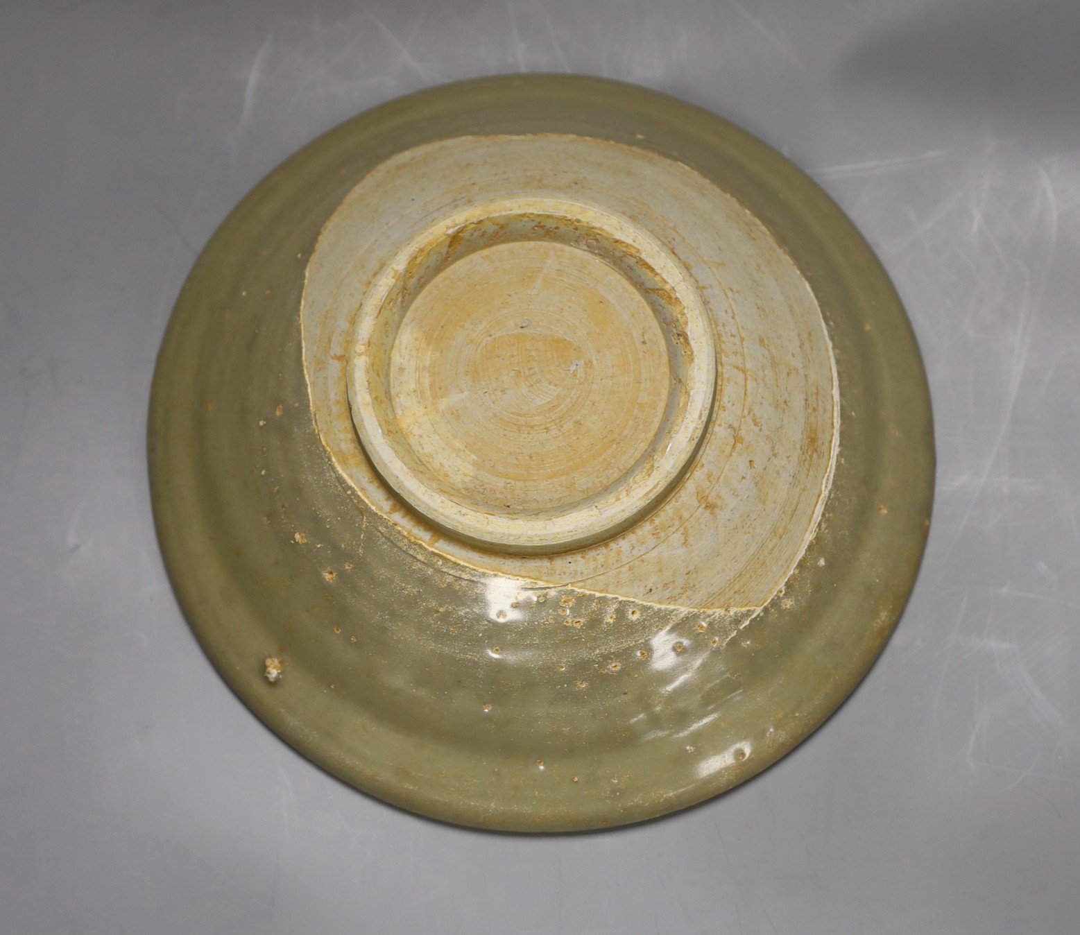 A Chinese celadon dish, Yuan dynasty, 27cm